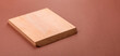 © chernikovatv - Empty wooden cutting board on a monochrome brown background