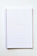 © Abdul - Blank lined notebook page with spiral binding on a clean white surface for writing notes