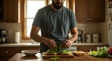 Man Making Sandwiches at Kitchen Counter with Fresh Greens