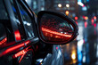 © Imran - Car Side Mirror Reflecting Vibrant City Lights and Raindrops on a Rainy Night.