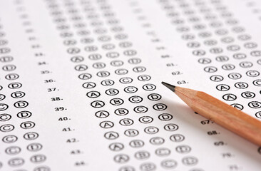 Wall Mural - Close up view of a blank sheet of test exam paper and a pencil