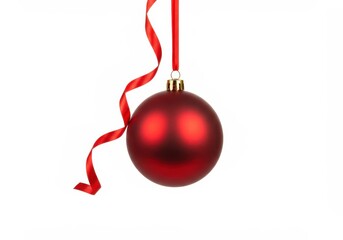 Wall Mural - A shiny red christmas ornament hangs from a red ribbon against a bright white background, festive and simple