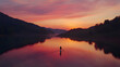 © smevg - Paddleboarding at Sunset: Serene Lake Landscape