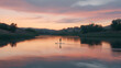 © smevg - Paddle Boarding at Sunset: A Serene Lake Landscape
