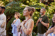 © Rido - Serene and positive diverse people meditating with gratitude