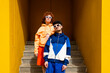 © VISTA by Westend61 - Two friends in urban clothing standing confidently near stairs on a sunny day