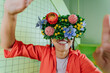 © VISTA by Westend61 - Woman wearing floral VR headset indoors smiling