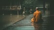 © mlangsen - Monk sits in rain by pond, contemplative mood