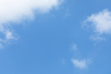 Wall Mural - blue sky background and white clouds soft focus, space in the middle, horizontal shape.