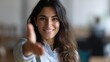 © Алексей Иванченко - Positive successful Latin business woman lending arm at camera, offering welcoming hand, career start, professional support, inviting job candidates for