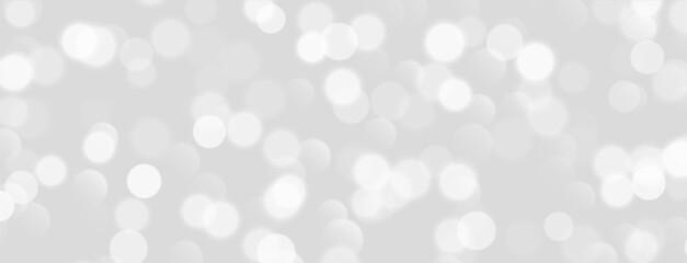 Wall Mural - white bokeh, blurred grey background with sparkling lights, blurry glitter effect. bright soft abstr