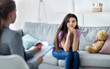 © Prostock-studio - Female psychologist consulting depressed Indian teenage girl at office. Counsellor working with upset youth, helping with mental problems, treating mental disorder or neurosis at clinic