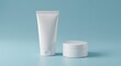 © Penggila - Minimalist Product Display: White Cream Tube and Jar on Blue Background