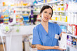 © JackF - Positive female pharmacist offers various body care medicines