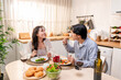 © Pavitra - Asian young couple having dinner to celebrate valentine's day together.