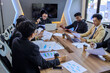 © Gatot - Corporate business team and manager in a meeting conference room