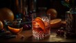© Stocksy - Cocktail in a glass with ice and orange slice on a wooden surface.