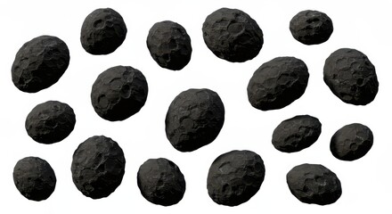 A collection of dark gray irregular shaped objects with rough surfaces scattered on a white background