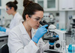 © Background - female scientist looking at a microscope