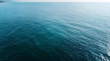 Aufkleber - Experience the tranquility of a deep azure ocean surface showcasing gentle ripples and variations in shade, complemented by clear copy space for creative use