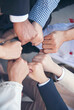 © aFotostock - Vertical Diversity Hands join empower partnership teams connection community. Success Mergers acquisitions partnership