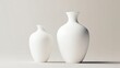 © yong - Two white vases of different sizes placed side-by-side against a light background.