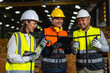 © BJ Day Stock - Professional asian engineer and technician wearing safety helmet analyzing meeting with tablet in factory warehouse. Confident factory workers group inspection industry factory. Teamwork concept.