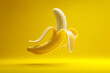 © shakir - Partially Peeled Yellow Banana on Yellow Background