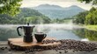 © Adex - Serene Morning Coffee by the Lake: A picturesque view of a steaming cup of coffee and coffee maker alongside a tranquil lake nestled amidst misty mountains, a perfect start to a peaceful day.