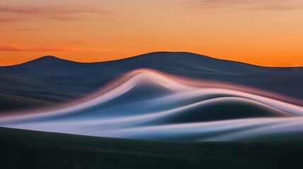 Wall Mural - a crisp picture of majestic mountains against a fiery sunset and fluffy clouds in the foreground