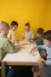© ADDICTIVE STOCK - Children Engaged in Creative Art Activities in Classroom