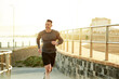 © MollerFinest/peopleimages.com - Mature man, running and athlete on beach promenade, sports workout and activity for mobility health. Male person, physical challenge and training for marathon, outdoor and cardiovascular exercise