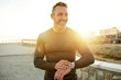 © peopleimages.com - Outdoor, smart watch and man with progress, runner and challenge with tracker, sunshine and time. Person, body health and athlete with digital app, exercise and wellness with monitor and fitness