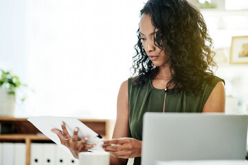 Poster - Business woman, HR and documents with laptop for corporate policy, schedule or procedures at office. Female person, paperwork or reading with resume for onboarding process, relations or compensation
