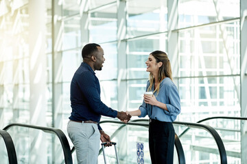 Poster - Escalator, handshake and luggage with business people in airport lobby for friendly greeting or meeting. B2B, travel or welcome with employee man and woman shaking hands for international partnership