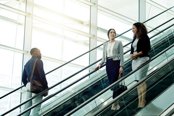 Poster - Employees, escalator and morning in office building for business, new day or coworkers on lift. People, corporate team or stairs in company with meeting schedule, discussion or planning productivity