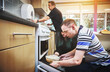 © Dean Mitchell/peopleimages.com - Food, development and disability by man learning basic baking skills in healthcare facility for people with special needs. Mature couple helping male with down syndrome, encourage independence skill