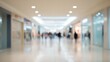 © Maria - minimalist photo capturing wide entrance of shopping mall with blurred people in background maintaining abundant copy
