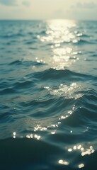 Aufkleber - Sunlit Ripples: A Serene Ocean Surface Reflecting Golden Light, Creating a Calming and Mesmerizing Seascape