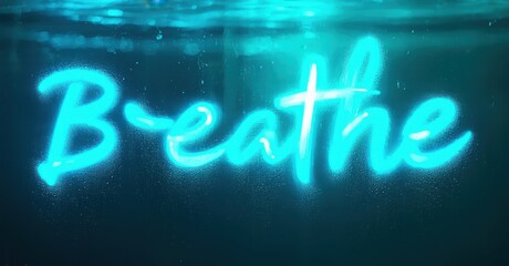 Poster - Bright blue text reads Breathe underwater. Light refracts, creating shimmering effect. Peaceful, calming imagery evokes serenity.