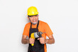 © 2p2play - Portrait worker in black uniform with electric drill isolated on white background