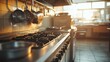 © loxia stock image - Commercial kitchen, gas stove, stainless steel appliances, warm sunlight
