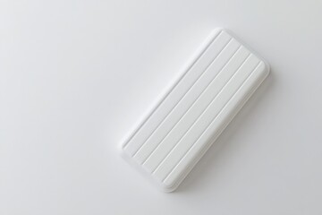 Fototapete - A pristine white container with parallel ridges sits on a bright, minimalist surface, highlighting clean design and simplicity.