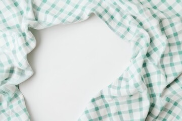 Leinwandbilder - Light teal and white checkered fabric draped in a circle on a white background