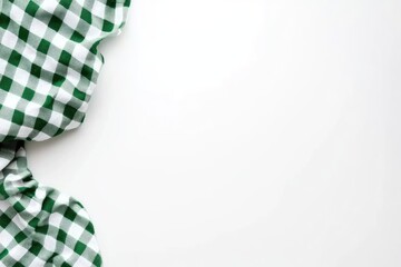 Leinwandbilder - Green and white checkered fabric draped on white surface