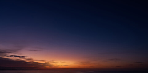 Wall Mural - sunset, sky blue, purple background,summer sundown with dramatic cloudy in orange, yellow over sea o
