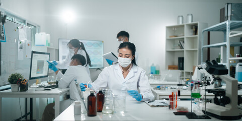 Wall Mural - medical science and technology professionals working in a laboratory research environment where scie
