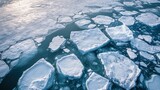 Aerial view of drifting ice floes in the Arctic Ocean reflecting sunlight