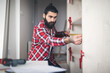 © Aleksandar - Young man making his own furniture at home