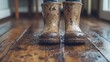 © Ms. Fox - Muddy boots on wooden floor reflecting rainy day adventure